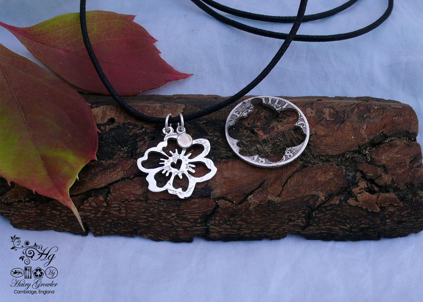 Handcrafted and recycled sterling silver shilling hawaiian flower necklace