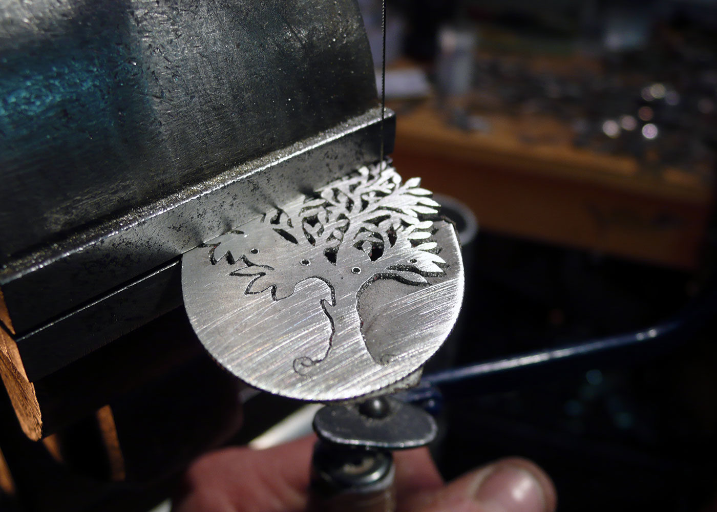 Handmade and repurposed silver Glimpses of summer tree necklace being made in the workshop