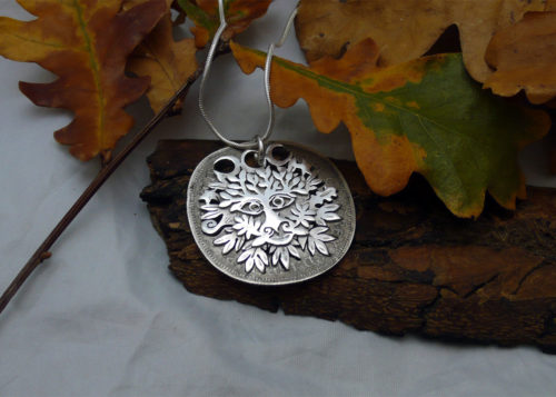 Handcrafted and recycled silver shilling greenman necklace reverse of coin