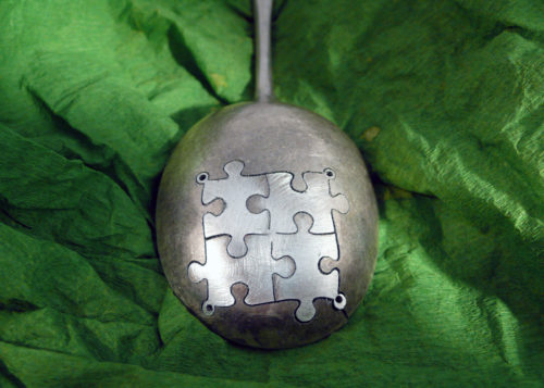 handcrafted and recycled spoon jigsaw-pieces earrings