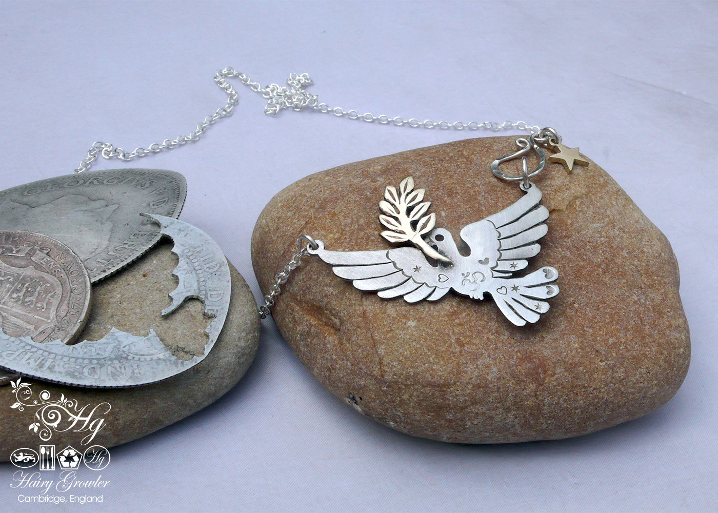 Handcrafted and recycled sterling silver beautiful peace and love doves necklace.