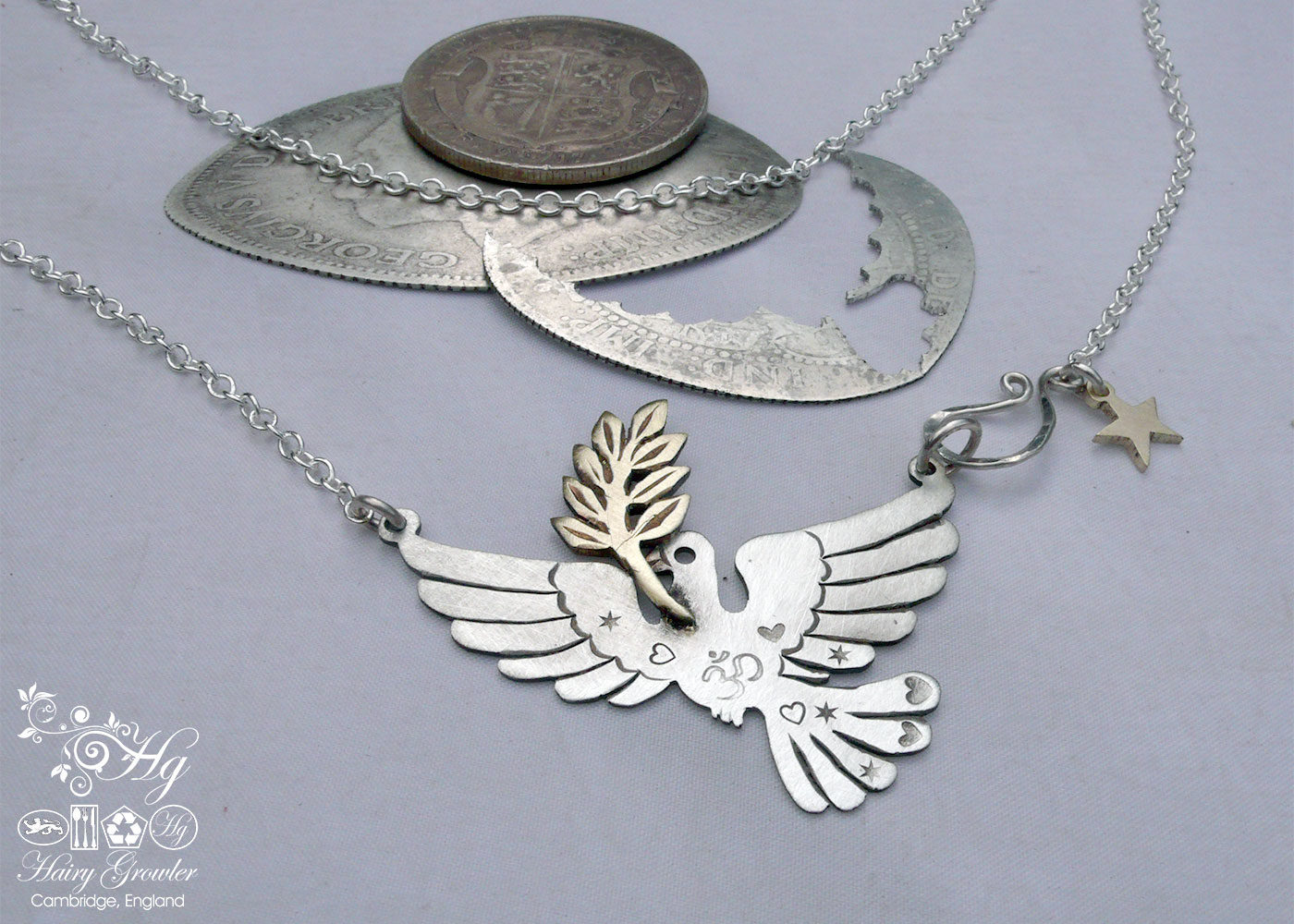 Handcrafted and recycled sterling silver beautiful peace and love doves necklace.