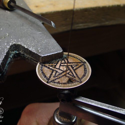 Hand cut pentacle coin pendant made as a personal talisman in the Hg workshop