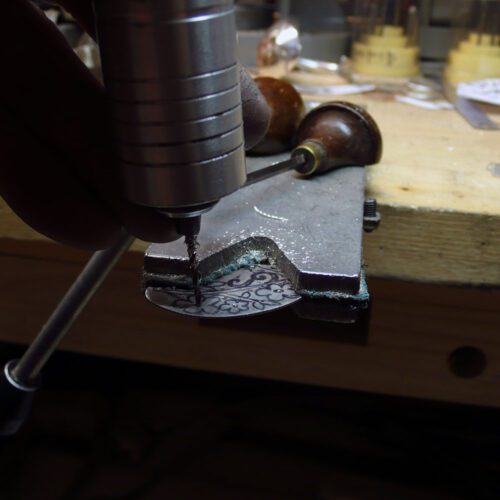Handcrafted and recycled sterling silver 'Tweet me' necklace being made in the workshop