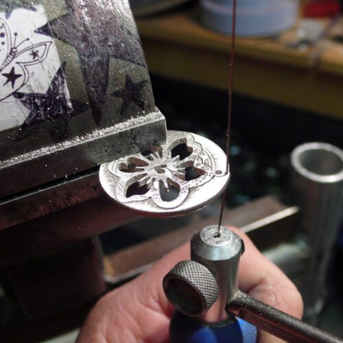 Handcrafted and recycled sterling silver shilling hawaiian flower necklace
