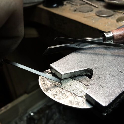 handcrafted and upcycled silver coin feather necklace pendant