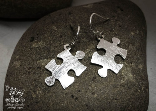 handmade and upcycled spoon jigsaw-pieces earrings