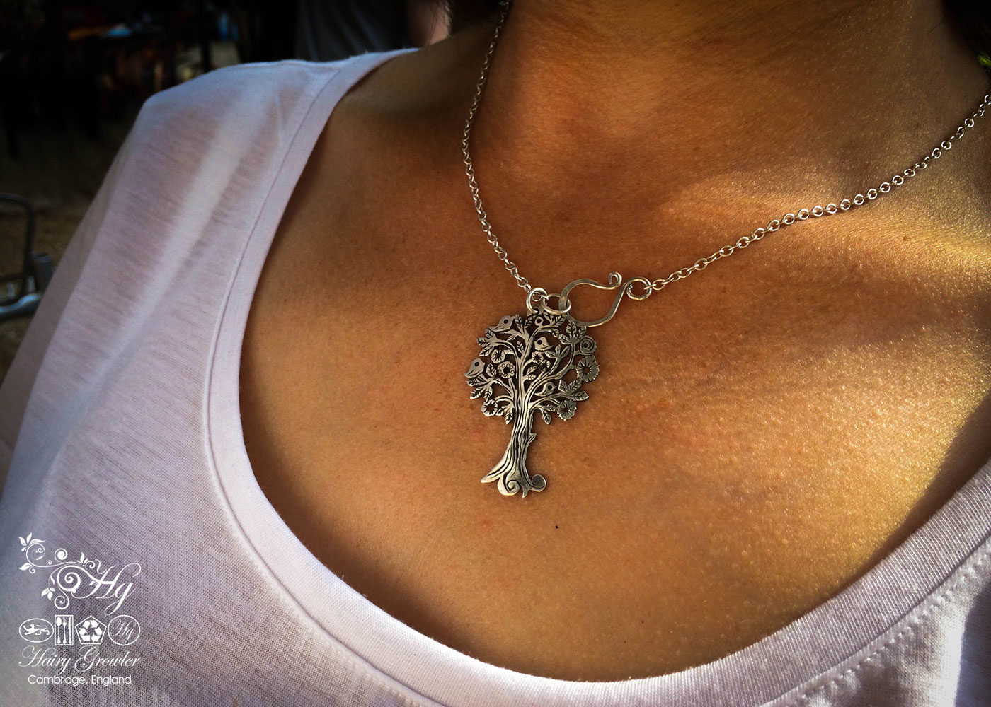 Handmade and repurposed silver Summer tree and tweeting birds made from a silver coin