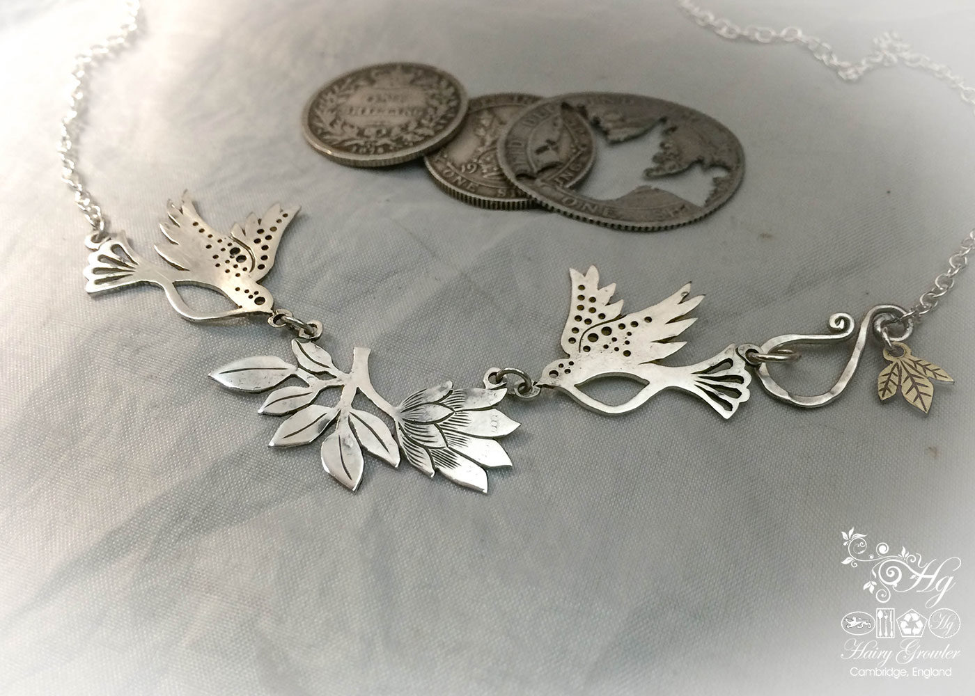 Hand made and repurposed sterling silver beautiful sparkling doves and lotus flower necklace made from silver shillings