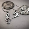 handcrafted bass and treble clef silver earrings made from upcycled silver coins