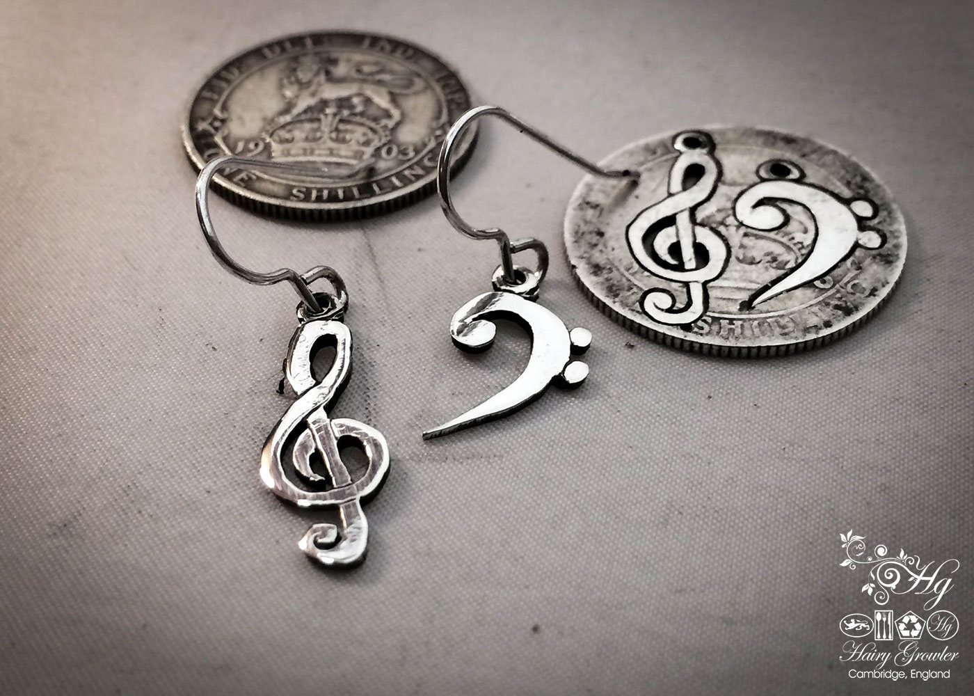 handcrafted bass and treble clef silver earrings made from upcycled silver coins