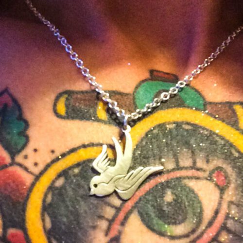 handcrafted and recycled silver coin swallow necklace pendant