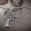 Handcrafted and repurposed silver woodland tree with owl sitting in the branches