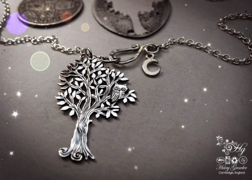 Handcrafted and repurposed silver woodland tree with owl sitting in the branches