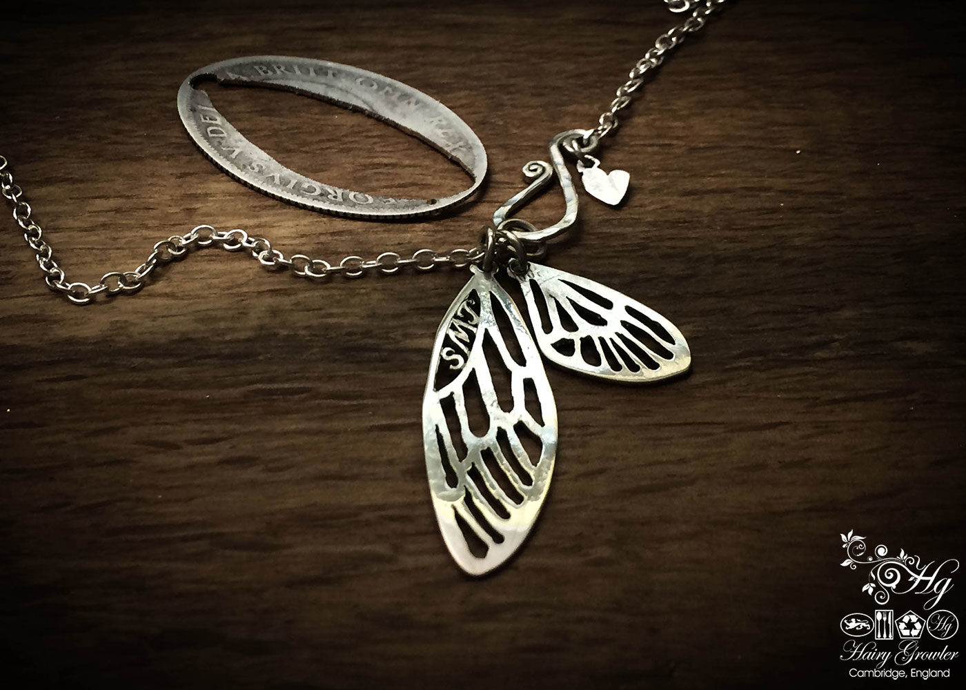 Handmade, recycled, sterling silver fairy faerie wings necklace being handmade