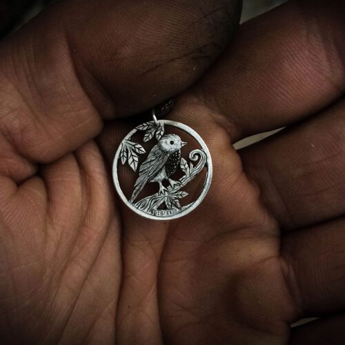handmade and recycled silver sixpence coin lucky tweet necklace