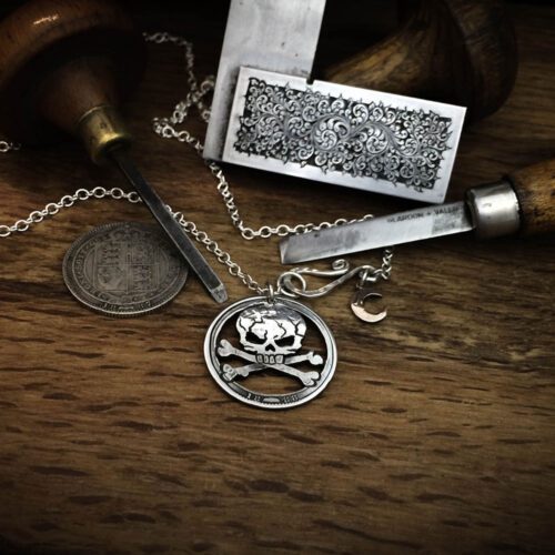 handcrafted and recycled silver shilling pirate skull and crossbones necklace