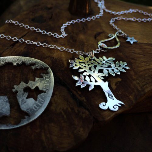 Handmade and upcycled silver spring tree made from a silver coin