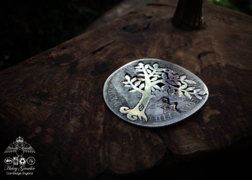 Handmade and upcycled silver spring tree made from a silver coin