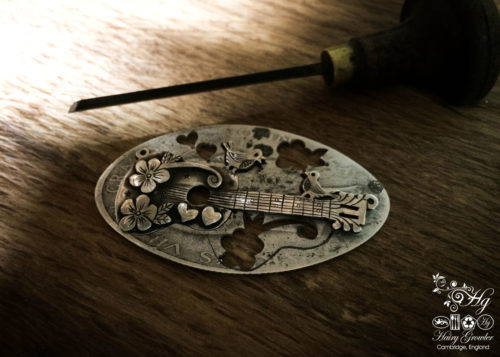 Handmade and upcycled sterling silver bird guitar necklace