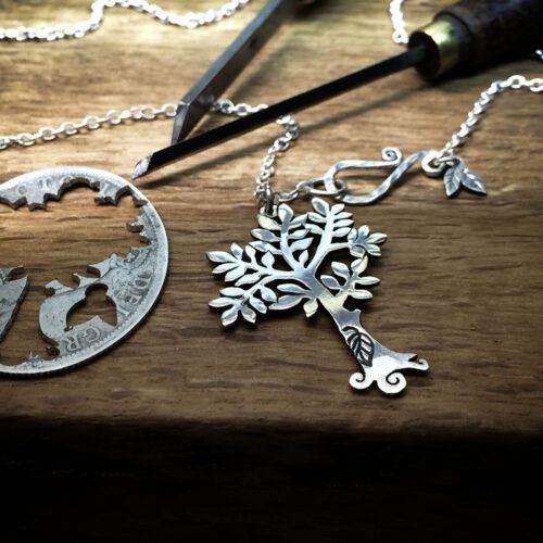 Handcrafted and recycled silver spring tree made from a silver coin