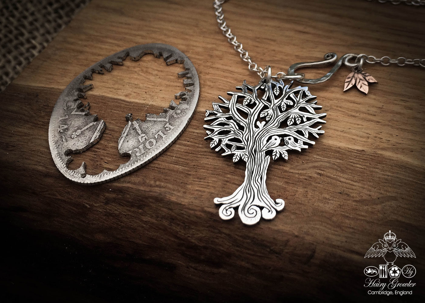 Handcrafted and recycled silver Autumn Tree necklace made from a British silver coin in the Hairy Growler Workshop in Cambridge, UK