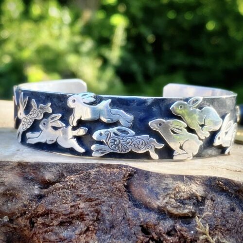 hand crafted and ethically created using recycled raw materials sourced from old unwanted uncollectible coins. Leaping magical bunny and rabbit jewelry