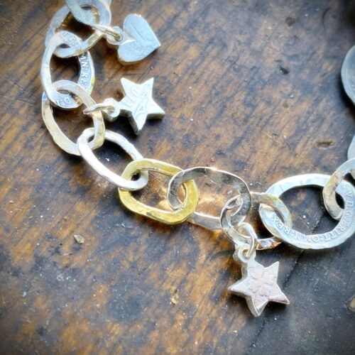 Personalised initials, hearts and stars bracelet individually handcrafted and recycled from an old Victorian silver coins and recycled ethical gold