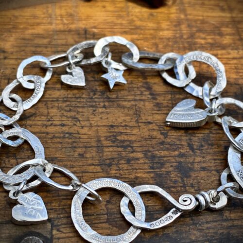 Personalised initials, hearts and stars bracelet individually handcrafted and recycled from an old Victorian silver coins and recycled ethical gold