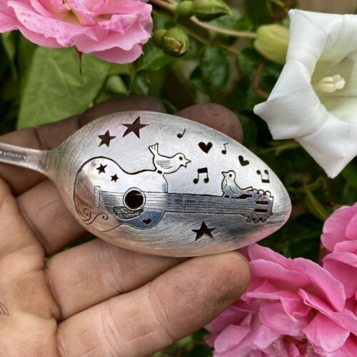 handcrafted and recycled spoon bird and guitar brooch