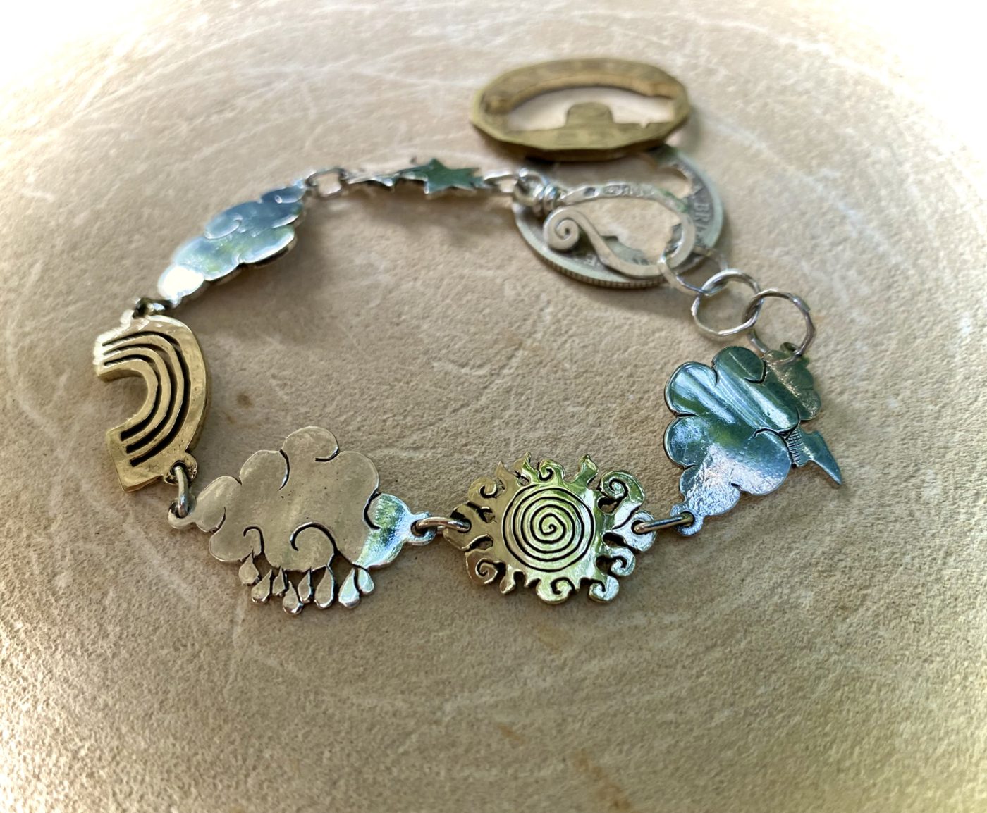 weather cloud sunshine bracelet handmade from up cycled silver coins