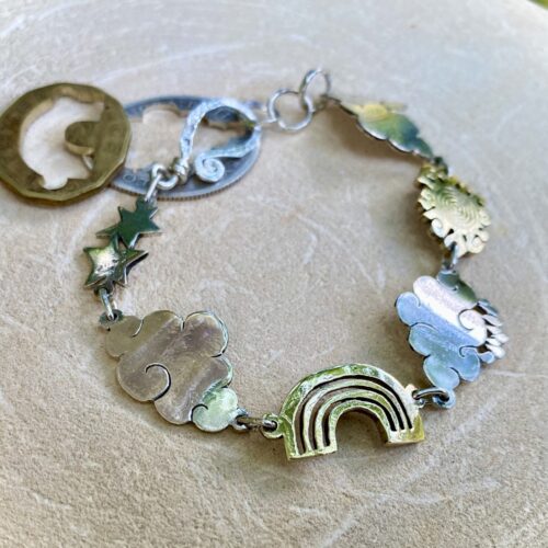 weather cloud sunshine bracelet handmade from up cycled silver coins and brass bronze coins