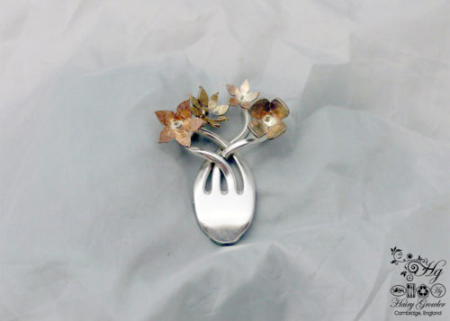 handcrafted and recycled fork flower brooch