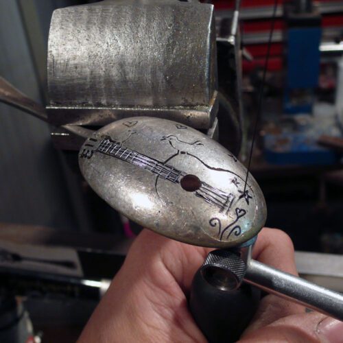 handcrafted and recycled spoon bird and guitar brooch