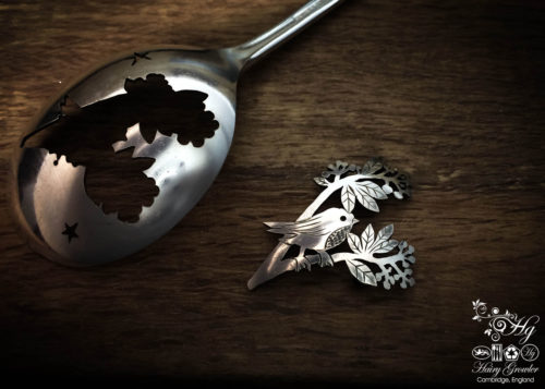 handmade and upcycled spoon bird on a berry branch brooch