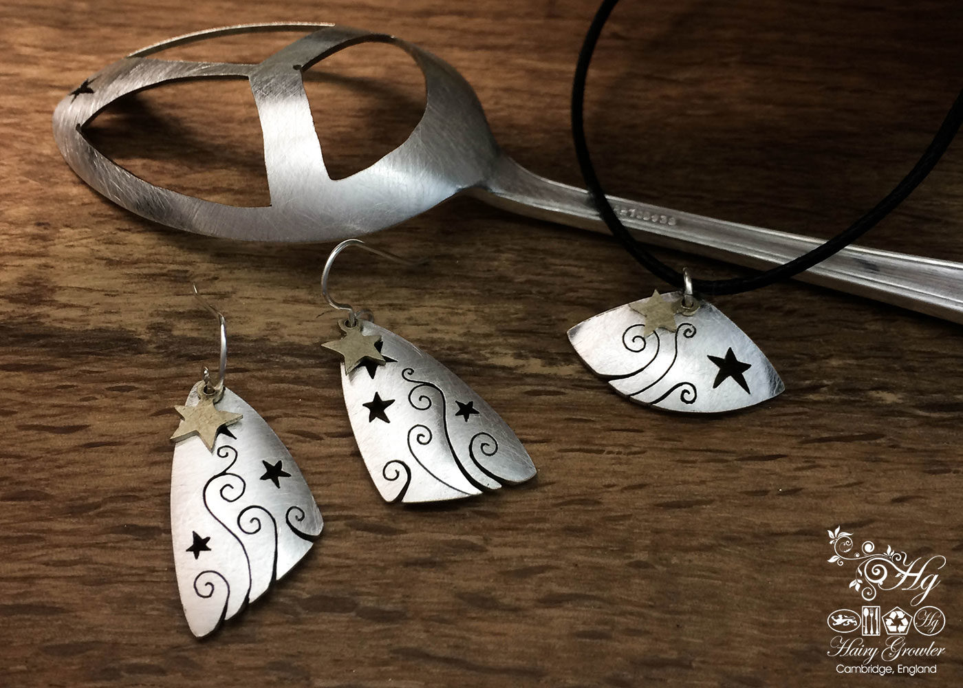 handcrafted and recycled spoon shooting and swirling star earrings