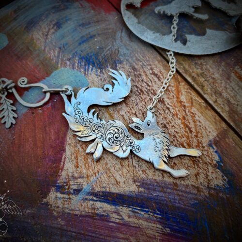 leaping and dancing vixen necklace made from silver coin