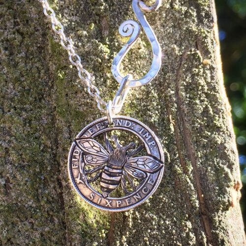Bee necklace coin jewellery handcrafted using traditional hand tools and techniques. Ethical jewellery made from silver coins. The sixpence traditionally a lucky coin.