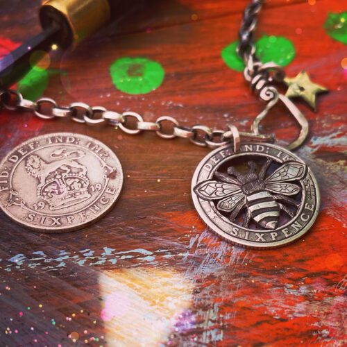 Bee necklace coin jewellery handcrafted using traditional hand tools and techniques. Ethical jewellery made from silver coins. The sixpence traditionally a lucky coin.