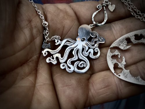 Handmade and upcycled, recycled silver coin kraken octopus necklace made in landlocked Cambridge, UK
