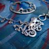 Handmade and upcycled, recycled silver coin kraken octopus necklace made in landlocked Cambridge, UK
