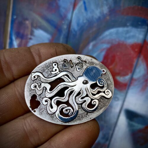 Handmade and upcycled, recycled silver coin kraken octopus necklace made in landlocked Cambridge, UK