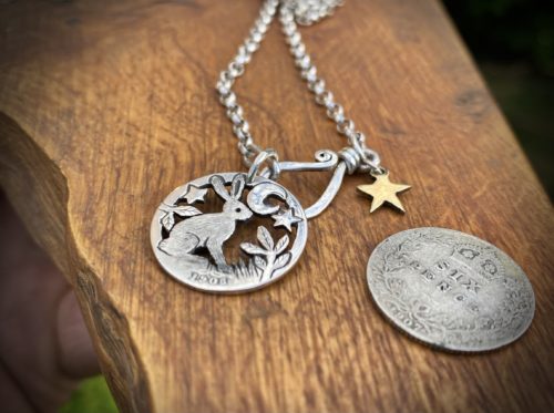 Handmade and upcycled silver sixpence coin hare pendant necklace