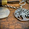 Handmade and upcycled coin owl in the tree pendant necklace