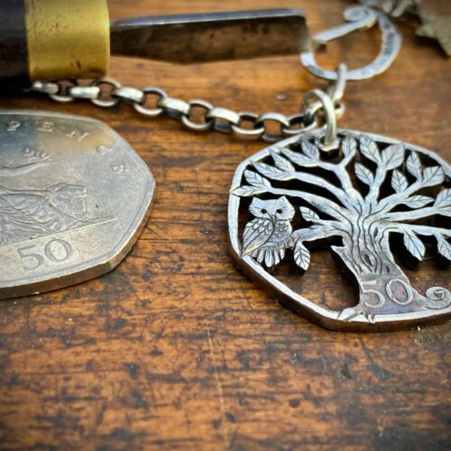 Handmade and upcycled coin owl in the tree pendant necklace