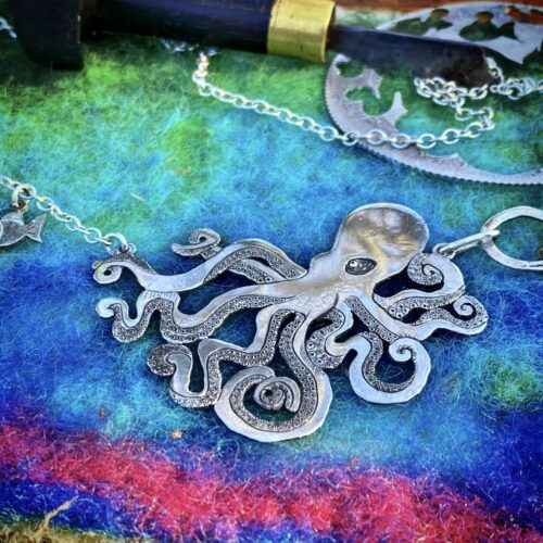 Handmade and upcycled, recycled silver coin kraken octopus necklace made in landlocked Cambridge, UK