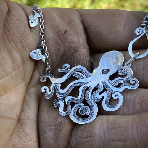 Handmade and upcycled, recycled silver coin kraken octopus necklace made in landlocked Cambridge, UK