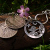 Hand-cut and repurposed silver sixpence coin birdsong tweet pendant necklace