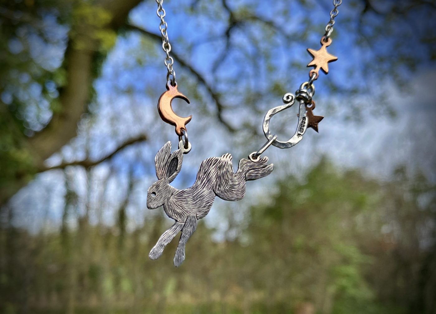 magical leaping rabbit hare folklore necklace made from recycled silver and coins