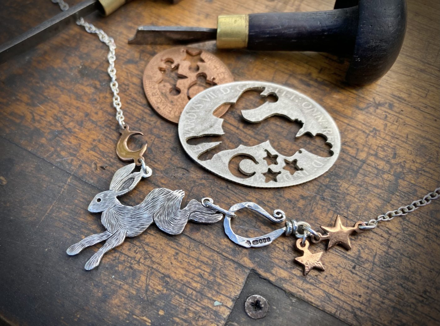 magical leaping rabbit hare folklore necklace made from recycled silver and coins